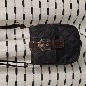 Avon classic quilted crossbody black with brown lining. Buckle front NWT…